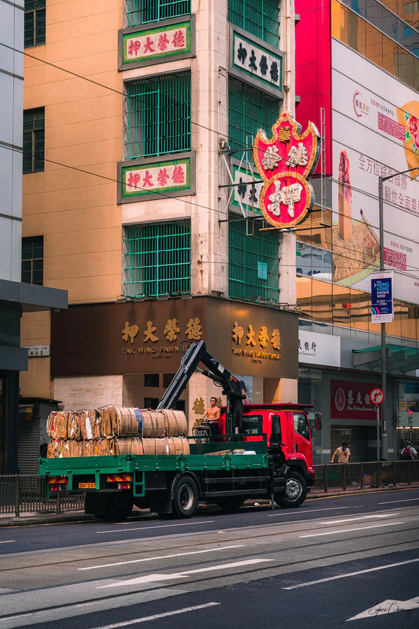 Street Photography shot of a worker proudly on duty in the morning in Sheung Wan, Hong Kong  Fine Art Limited Edition of 28. Photo © Copyright by Sylvère Clerempuy.