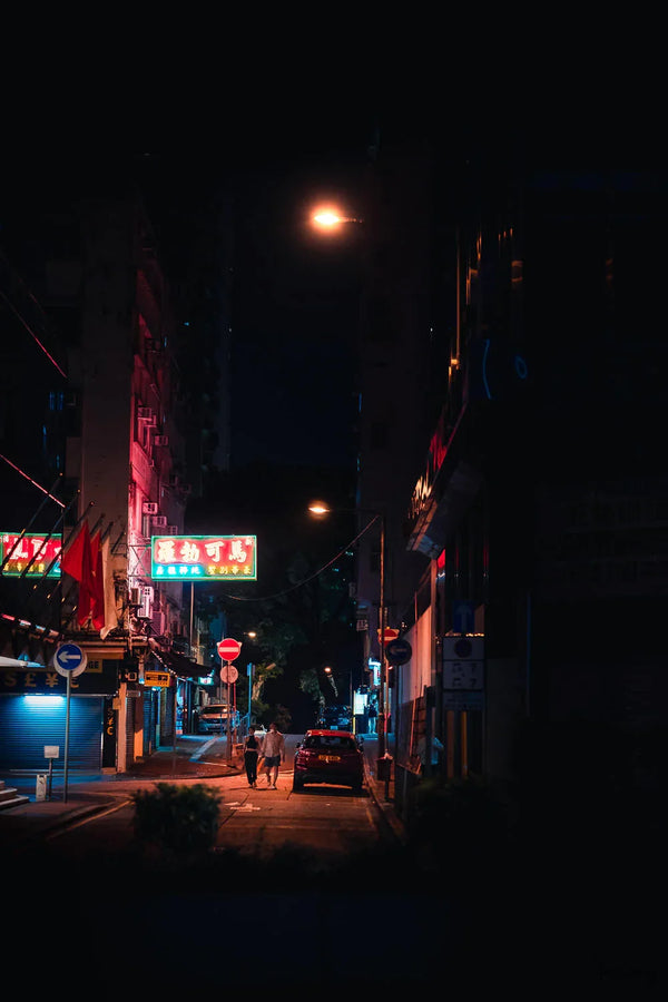 Night Street Photography shot of a couple maybe coming out of the motel "Marco Polo, Luxury Mansion" in Tsim Sha Tsui, Kowloon, Hong Kong.  Fine Art Limited Edition of 28. Photo © Copyright by Sylvère Clerempuy.
