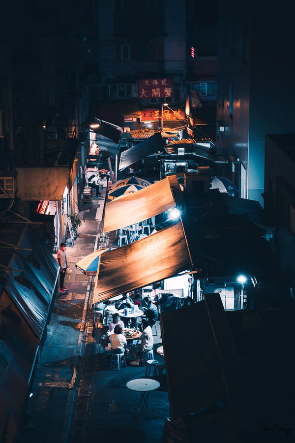 Locals gathering in the street to eat fried rice in Hong Kong Island, China.  Fine Art Limited Edition of 28. Photo © Copyright by Sylvère Clerempuy.