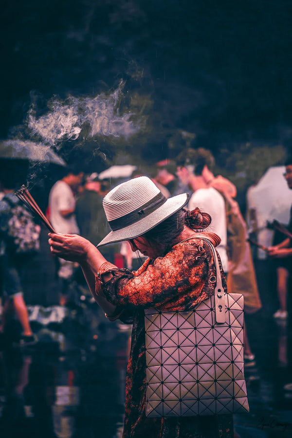 Woman praying in Lama Temple "YongHeGong" in Beijing, China.  Fine Art Limited Edition of 28. Photo © Copyright by Sylvère Clerempuy.
