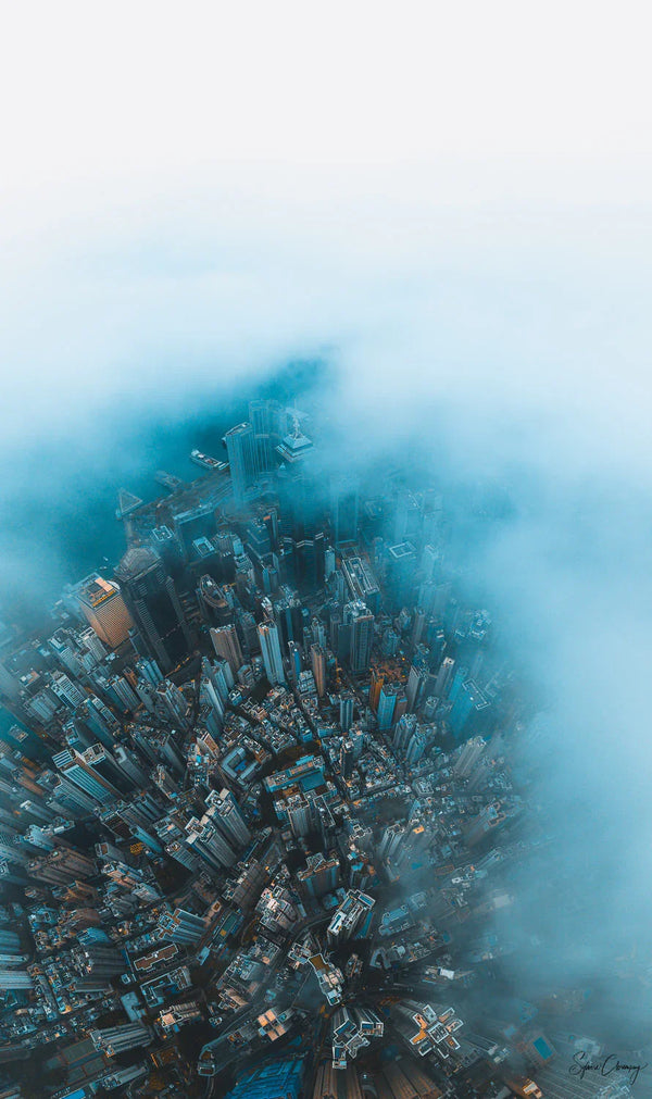 Aerial Urban Scene unfolding at dawn on Central - Hong Kong Island, unveiling the city after a stormy night. Fine Art Limited Edition of 28. Photo © Copyright by Sylvère Clerempuy .