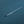 Minimal aerial of Victoria Harbour with a slim blue floating pier of dragon boats and a small motorboat leaving a white wake.