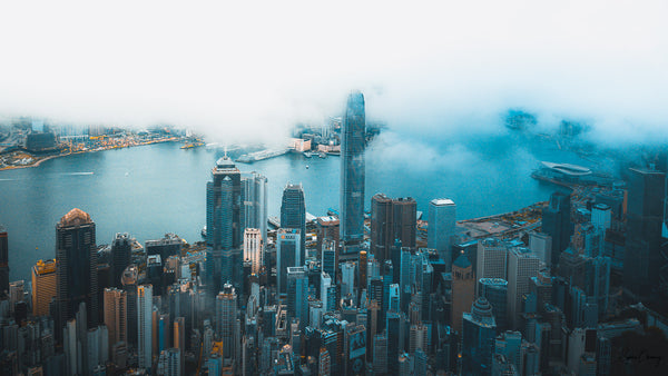 Aerial Urban Scene unfolding at dawn on Central - Hong Kong Island, unveiling the city after a stormy night.  Fine Art Limited Edition of 28. Photo © Copyright by Sylvère Clerempuy.