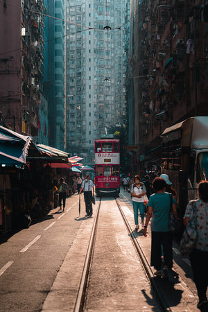 Street Photography shot of the Tramway coming Through North Point Market in North Point, Hong Kong.  Fine Art Limited Edition of 28. Photo © Copyright by Sylvère Clerempuy.