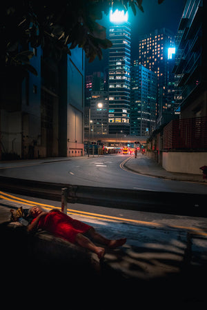 Night Street Shoot of a lady resting in the street at night in Central, Hong Kong.  Fine Art Limited Edition of 28. Photoa © Copyright by Sylvère Clerempuy.