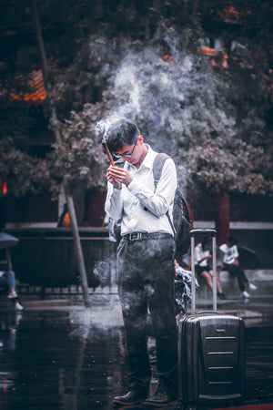 Insence shrouded man praying right before catching a plane in Lama Temple "YongHeGong" in Beijing, China.  Fine Art Limited Edition of 28. Photo © Copyright by Sylvère Clerempuy.