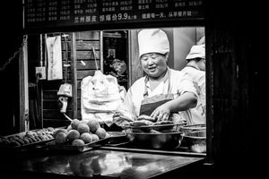 5am Street shot of local happily preparing breafast in Beixinqiao, Beijing, China.  Fine Art Limited Edition of 28. Photo © Copyright by Sylvère Clerempuy.